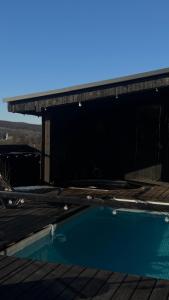 a swimming pool on the roof of a house at Shalash 2 in Velikiye Lazy +35 photos