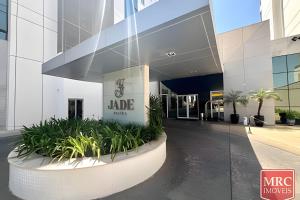 a lobby of a building with a sign on it at Flat moderno Jade hotel in Brasília