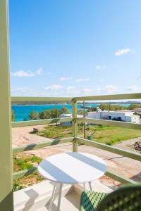 a view of the ocean from the balcony of a house at Villa Selina 1 - Etheras Properties in Kythira