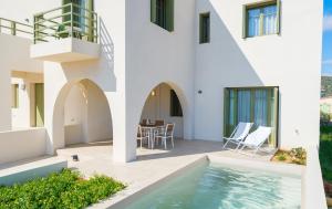 a villa with a swimming pool and a house at Villa Selina 1 - Etheras Properties in Kythira