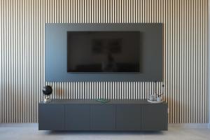 a television on top of a cabinet in a room at Djuric Apartmani in Zaječar