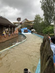 a water slide in a theme park with two boats at Pension Haus Fürstenberg in Beierfeld
