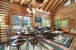 a dining room with a table and chairs at 2mils Dollywood, Resort Pool, King Bed, SL6 in Pigeon Forge