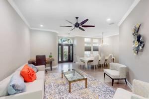 a living room with a white couch and a table at The Riverview Estates in Riverview