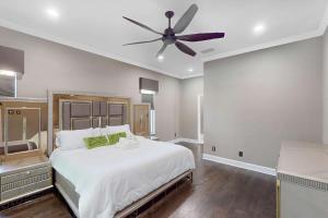 a bedroom with a large bed with a ceiling fan at The Riverview Estates in Riverview +37 photos