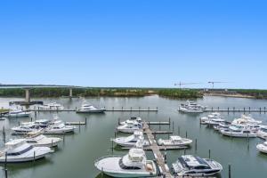 a bunch of boats are docked in a harbor at Wharf 615 by Youngs Suncoast in Orange Beach