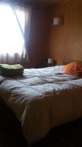 Een bed of bedden in een kamer bij Chacra Don Benito Chonchi