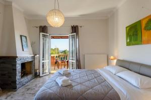 a bedroom with a bed and a fireplace at Maxim in Corfu +46 photos