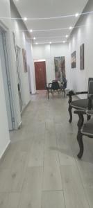 a large room with furniture and paintings on the walls at Apartamento-2B-Zona-Colonial in Santo Domingo