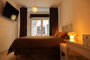 a bedroom with a bed and a window at Loft Valentia Ifach Calpe in Calpe