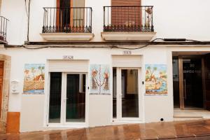 a building with paintings on the side of it at Loft Valentia Ifach Calpe in Calpe