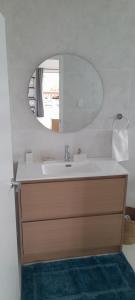 a bathroom with a sink and a mirror at Reureu Ocean Vistas in Arutanga +12 photos