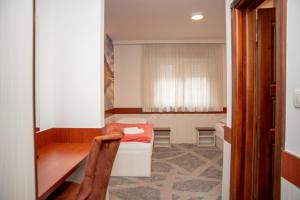 a small room with a bed and a window at Villa Bojcic in Mostar +43 photos