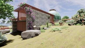 a garden with a building and a glass dome at Domo Geodesico de Luxo Astrum Vallis in Rio de Contas +7 photos