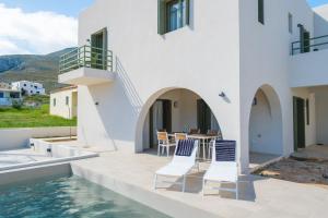 a villa with a swimming pool and a house at Villa Selina 7 - Etheras Properties in Kythira