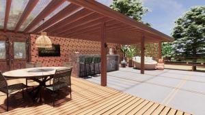 a pavilion with a table and chairs on a deck at Domo Geodesico de Luxo Astrum Vallis in Rio de Contas