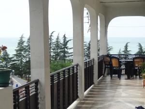 a balcony with a view of the ocean at Guest House TeNi in Makhinjauri