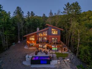 an overhead view of a house in the woods at Epic Views, 9Mi SR, GameRmTheater, HTub, Sauna in Bethel