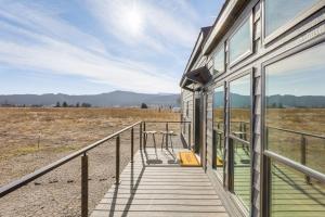 a porch of a house with a view of a field at "Cozy Montana" Home w/ Mountain Views! in Kalispell