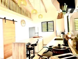 a kitchen with a stove and a counter top at Villa Tiare in Bora Bora