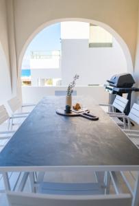 a table with a plant sitting on top of it at Villa Selina 8 - Etheras Properties in Kythira