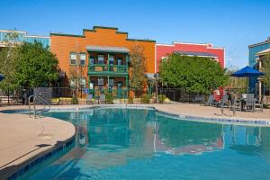 a swimming pool in front of a building at WorldMark Bison Ranch in Overgaard