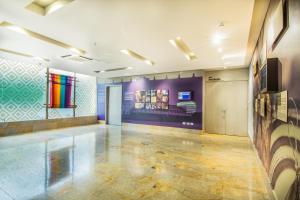 a room with colorful paintings on the walls at GHL Hotel Monteria in Montería