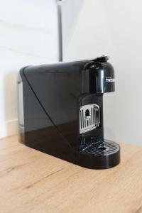 a black toaster oven sitting on top of a table at Pinedo Playa Holiday 2 in Valencia