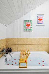 a bath tub with a toy sitting in it at The HIDE - Loftette in Ploieşti