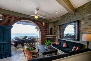 a living room with a couch and a table at Quinta Maria Cortez Beach Hotel in Puerto Vallarta