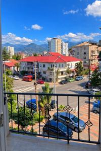 a balcony with a view of a parking lot at Emilia Hotel Batumi Old Town in Batumi