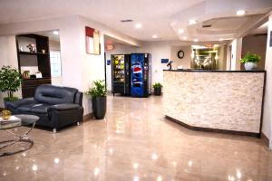 a lobby with a waiting room with a soda machine at Microtel Inn by Wyndham - Murfreesboro in Murfreesboro