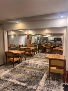 a dining room with wooden tables and chairs at Ramona Lara in Antalya