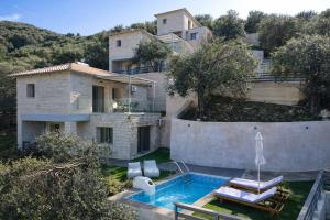 an aerial view of a house with a swimming pool at Saint Helen Villas in Parga