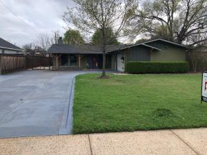 a house with a tree in front of a driveway at Creation Resorts in Williamstown