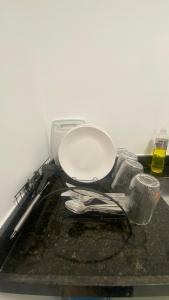 a pile of utensils sitting on top of a counter at Sou mais Icarai in Niterói +15 photos