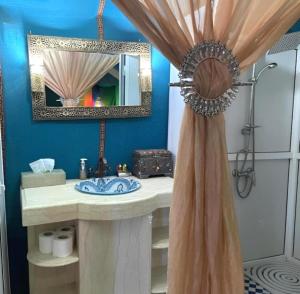 a bathroom with a sink and a mirror at Starry Nights Camp in Merzouga +24 photos