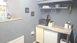 a kitchen with a counter with a microwave on it at The Serendipity Suite - A Scenic Countryside Hideaway in Letterkenny
