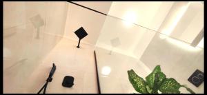 a glass wall with a potted plant in a room at Knossos Sunrise in Palekastron
