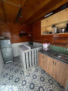 a kitchen with a sink and a counter top at Surf house in Essaouira +30 photos