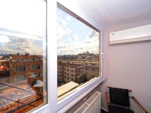 a large window with a view of a city at diamond premium hotel in Istanbul