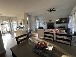 a living room with a couch and a table at Rockwall Harbor Retreat in Rockwall