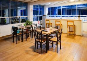 a group of tables and chairs in an office at Mariandes Hostel in Huaraz