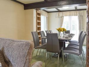 a dining room with a table and chairs at Bank Lane House in Freckleton
