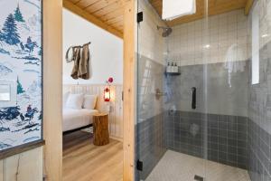 a bathroom with a shower and a glass door at Hotel Palomino in Ridgway