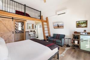 a bedroom with a bunk bed and a staircase at Hotel Palomino in Ridgway