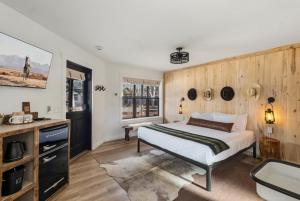 a bedroom with a bed and a tv at Hotel Palomino in Ridgway +54 photos