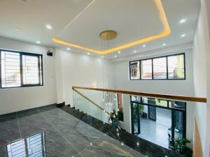 an empty hallway with a staircase in a house at Bhome in Vung Tau +2 photos