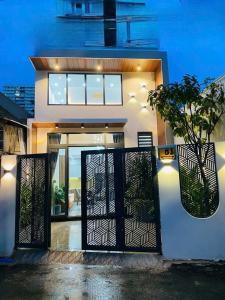 a house with a black and white front door at Bhome in Vung Tau