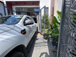 a white truck parked in front of a house at Bhome in Vung Tau